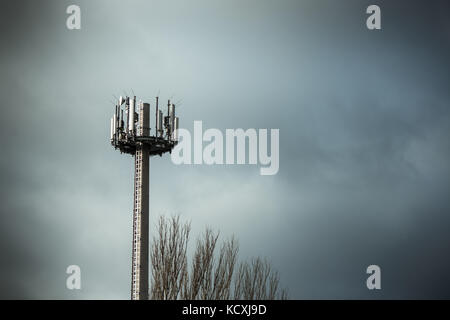 Cellphone mobile pone transmission tower with clouds Stock Photo