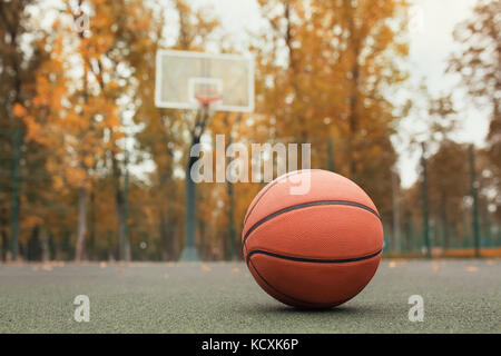 basketball ball on the outdoors cour Stock Photo