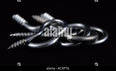 stainless steel hook with conical thread, a group of abstract metal hook Stock Photo