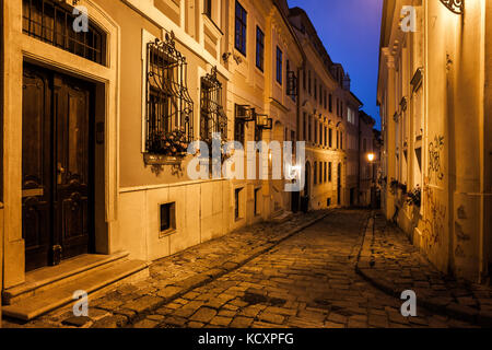 City of Bratislava in Slovakia at night, narrow cobblestone street in the Old Town Stock Photo