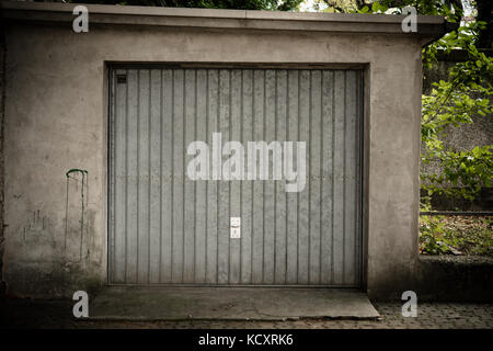 Old garage with metal door Stock Photo