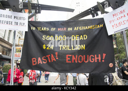 Antiwar activists held a vigil, march and demonstration in New York City today marking the 16th Anniversary of the US invasion of Afghanistan, the longest war in American history. Sixteen years later, thousands of American soldiers have been killed, and there seems to be no end in sight to the war. Now the trump Administration wants to ramp it up even more. Literally trillions of dollars have been spent on it with seemingly nothing to show. Stock Photo