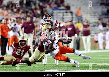 Chestnut Hill, Mass. 7th Oct, 2017. Virginia Tech Hokies wide receiver Sean Savoy (15) gets dragged down by Boston College Eagles defensive back Isaac Yiadom (20) during the NCAA division 1 football game between the Virginia Tech Hokies and the Boston College Eagles, held at Alumni Stadium, in Chestnut Hill, Mass. Virginia Tech defeats Boston College 23-10. Eric Canha/CSM/Alamy Live News Stock Photo