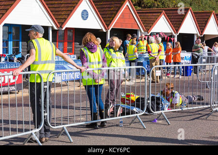 Bournemouth, Dorset, UK. 8th Oct, 2017. The final day of the Bournemouth Marathon Festival gets underway with the marathon and half marathon. Half marathon runners as the weather gets warmer and sunnier and temperatures rise. Medical attention needed for runner on the ground. Credit: Carolyn Jenkins/Alamy Live News Stock Photo