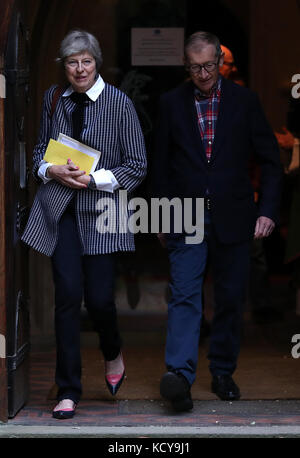 Prime Minister Theresa May and her husband Philip, leave after attending a service at St Andrew's Church in Sonning, Berkshire. Stock Photo