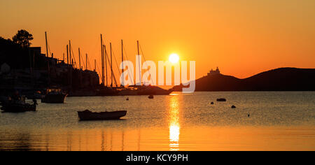 Greece, Kea island. Boats silhouette in the sea at sunset, Stock Photo