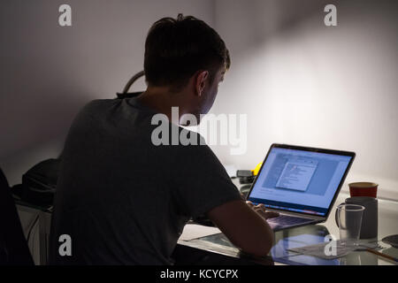 Man works at laptop Stock Photo