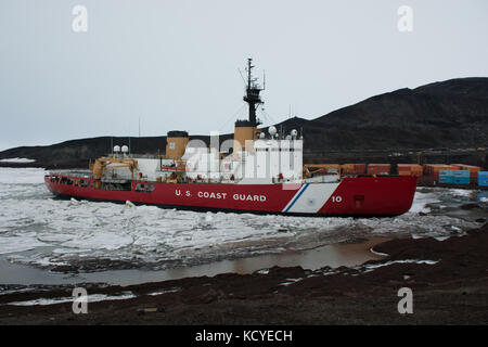 Coast guard cutter docking at Mcmurdo Station Antarctica Stock Photo