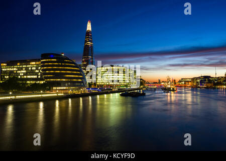 City Hall and The Shard at sunset with river Thames in foreground, London, United Kingdom Stock Photo