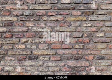 Close-up of an old and aged red brick wall texture background. Stock Photo