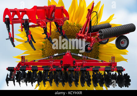 Farm equipment and implements - disc harrow, subsoiler, flat lifter and roller tractor trailer. Stock Photo