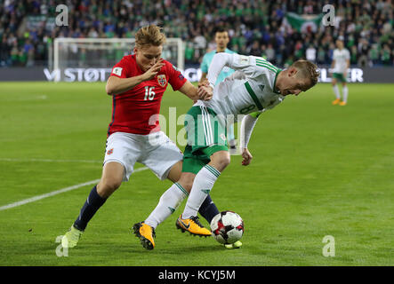 Norway's Jonas Svensson (left) and Northern Ireland's Steven Davis in action during the 2018 FIFA World Cup Qualifying Group C match at the Ullevaal Stadion, Oslo. Stock Photo