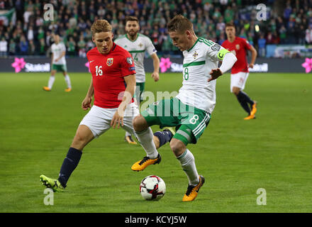 Norway's Jonas Svensson (left) and Northern Ireland's Steven Davis in action during the 2018 FIFA World Cup Qualifying Group C match at the Ullevaal Stadion, Oslo. Stock Photo