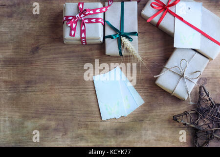 Selective closeup shot of decorated gift boxes wrapped with beige wrapping  paper Stock Photo by wirestock