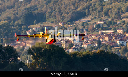 Vigili del fuoco, Italian firefighter Bombardier CL-415, Canadair 26 I-DPCI, from Roma Ciampino Airport, to load water in the lake. Amphibious plane Stock Photo