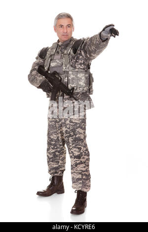 Mature Soldier Holding Rifle Isolated On White Background Stock Photo