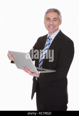 Happy Mature Businessman Using Laptop Over White Background Stock Photo