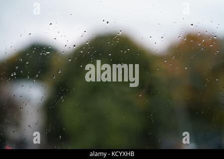 raindrops on window in autumn on high floor Stock Photo