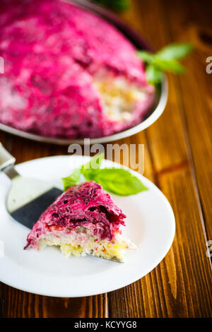 layered pastry salad with herring and beetroot Stock Photo