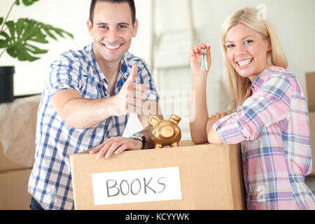 satisfied couple in their hew home, good saving Stock Photo