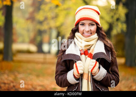 beautiful girl freezing in autumn park Stock Photo