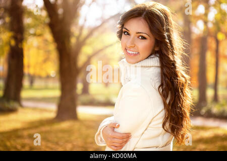 Portrait of very beautiful young woman in autumn park Stock Photo