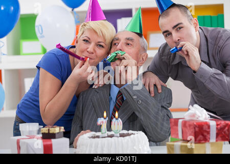 Happy family together celebrating 70th birthday Stock Photo