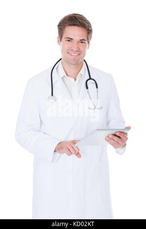 Happy Young Doctor Using Tablet Over White Background Stock Photo