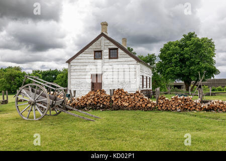Red River cart and farm managers house, Lower Fort Garry National Historic Site, Manitoba, Canada. Stock Photo