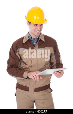 Happy Male Construction Worker Holding Digital Tablet On White Background Stock Photo