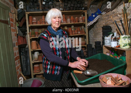 Gardener Mary Keen with her potting shed Stock Photo