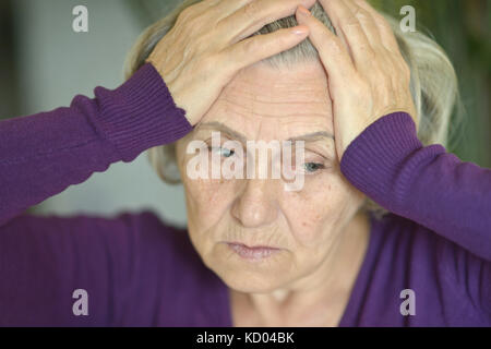 Beautiful sad elderly woman close-up Stock Photo