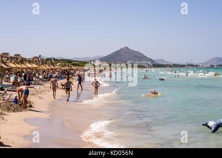 Tourists at Playa de Muro beach in summer peak season near Albufera resorts, Mallorca, Balearic islands Stock Photo