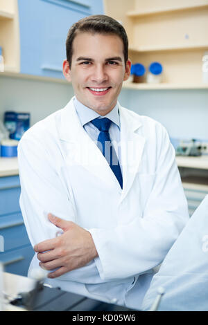 Handsome cheerful young dentist Stock Photo