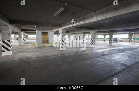 Parking garage of shopping center, underground interior Stock Photo