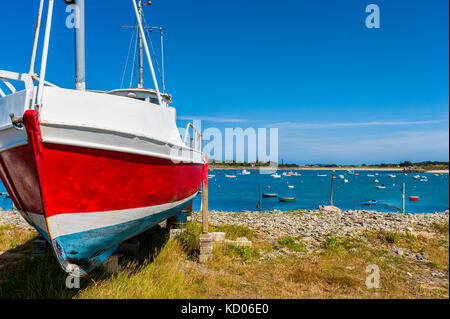 Fishing Boat on Shore in the Village of Vale, Guernsey, Channel Islands, UK on summer day Stock Photo