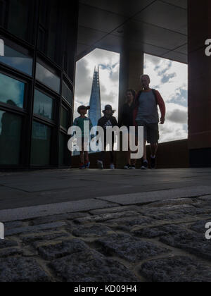 An unusual view of the Shard from the North Embankment with people walking, holding hands Stock Photo