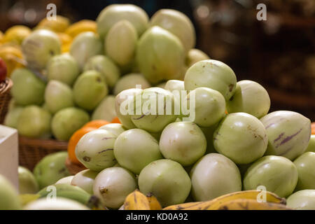Exotic umbu fruit at sale on the market. Stock Photo
