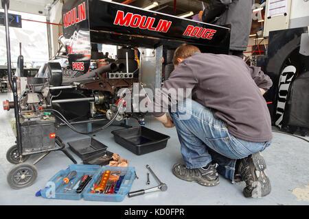 MAGNY-COURS, FRANCE, June 30, 2017 : Mechanic at work. The First French Historic Grand Prix takes place in Magny-Cours with a lot of ancient sports an Stock Photo