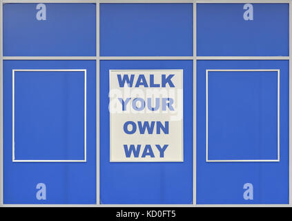 Text Walk Your Own Way written on blue background Stock Photo