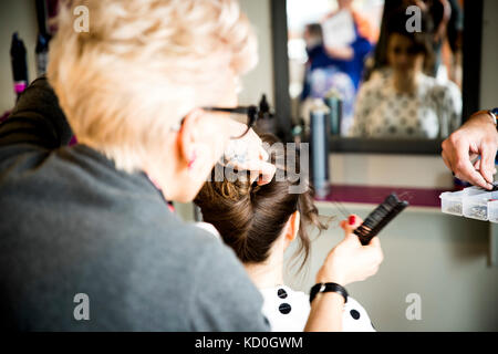 Woman working in quirky hair salon Stock Photo