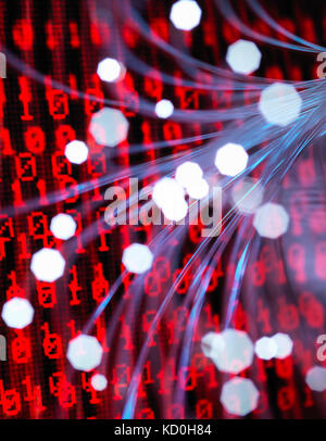 Fibre optics carrying data attacking a laptop computer which has a virus Stock Photo