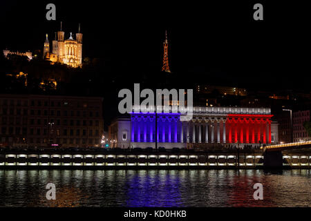 LYON, FRANCE, July 14, 2017 : The city of Lyon commemorates Bastille Day (French National Day) by a lightning of french colors on Palais de Justice, w Stock Photo