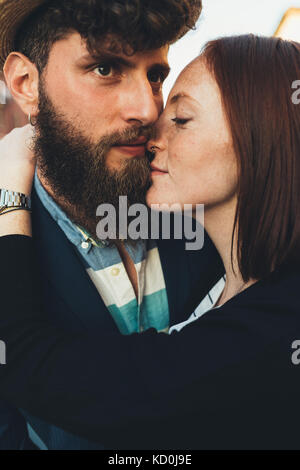 Head and shoulder shot of hipster couple embracing Stock Photo