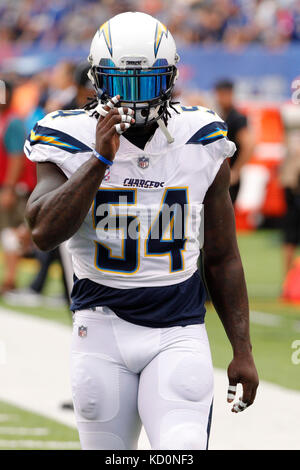 Los Angeles Chargers outside linebacker Thomas Davis (58) poses with former  Tennessee Titans linebacker Tim Shaw before an NFL football game Sunday,  Oct. 20, 2019, in Nashville, Tenn. Shaw was diagnosed in