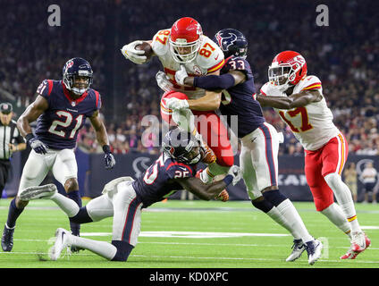 Houston, TX, USA. 8th Oct, 2017. Kansas City Chiefs tight end Travis Kelce (87) leaps over the tackle of Houston Texans cornerback Kareem Jackson (25) in the second quarter during the NFL game between the Kansas City Chiefs and the Houston Texans at NRG Stadium in Houston, TX. John Glaser/CSM/Alamy Live News Stock Photo