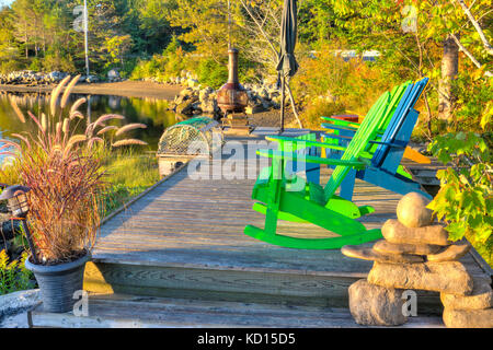 Lawn chair on wharf, Shad Bay, Nova Scotia, Canada Stock Photo