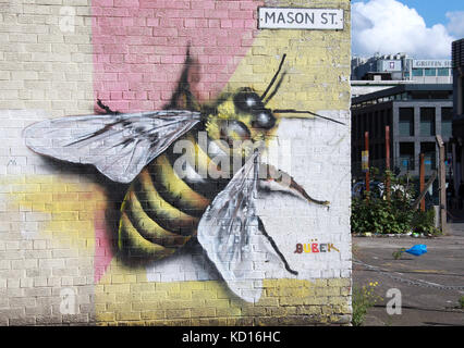 Mason Street with symbolic worker bee street art in the Northern Quarter of Manchester Stock Photo