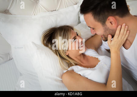 Handsome man and beautiful woman kissing each other Stock Photo
