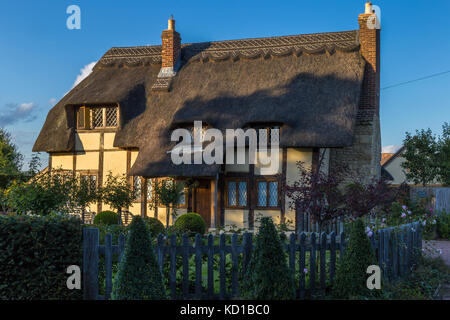 Black and white timber framed cottage with thatch roof Stock Photo